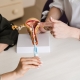 Closeup insert of intrauterine device IUD into your uterus model