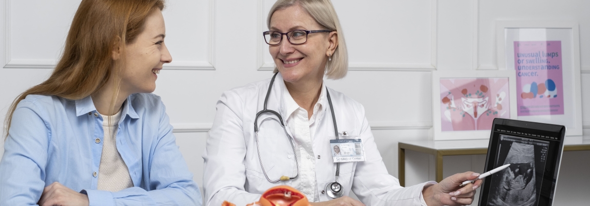 Patient holding tablet with female reproductive system