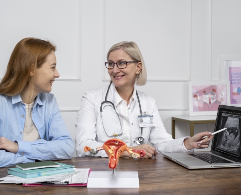 Patient holding tablet with female reproductive system