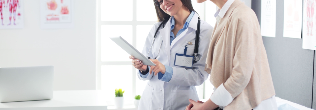 Specialist and patient discussing the best UFE clinic in South Africa while sitting in a consultation room