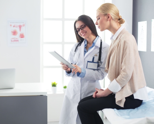 Specialist and patient discussing the best UFE clinic in South Africa while sitting in a consultation room