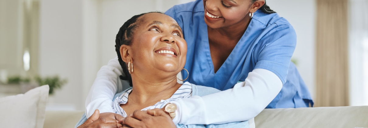 A young doctor comforting an elderly patient to help in understanding UFE success rates
