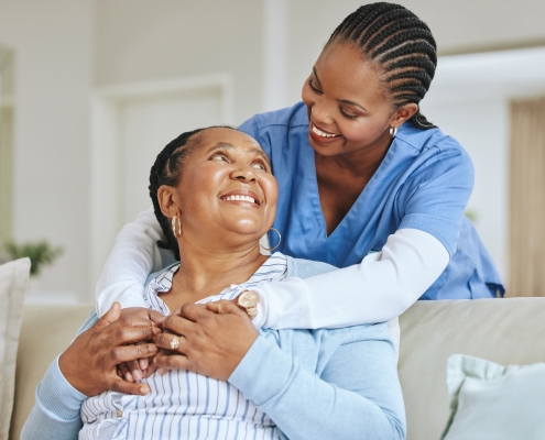 A young doctor comforting an elderly patient to help in understanding UFE success rates